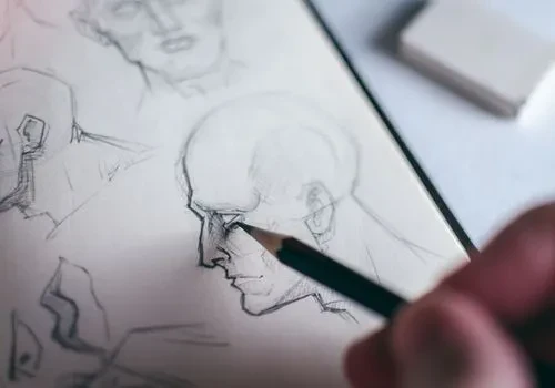 Someone sketching a figure