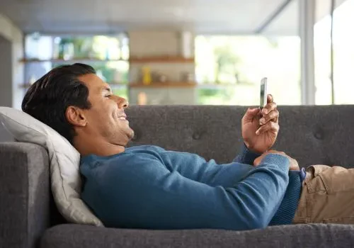 A happy man playing solitaire